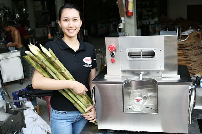 David's Cane Machine pressing fresh sugarcane